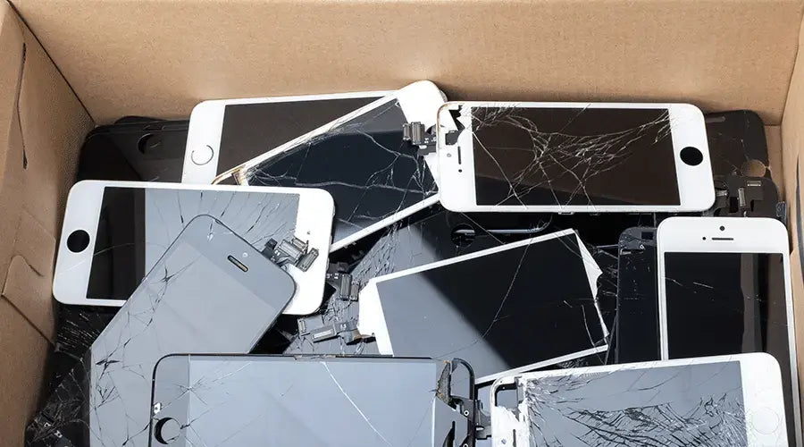 Technician testing smartphone at PayMore Milford MA