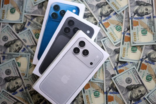 Assorted iPhone 11 and newer devices displayed during resale evaluation